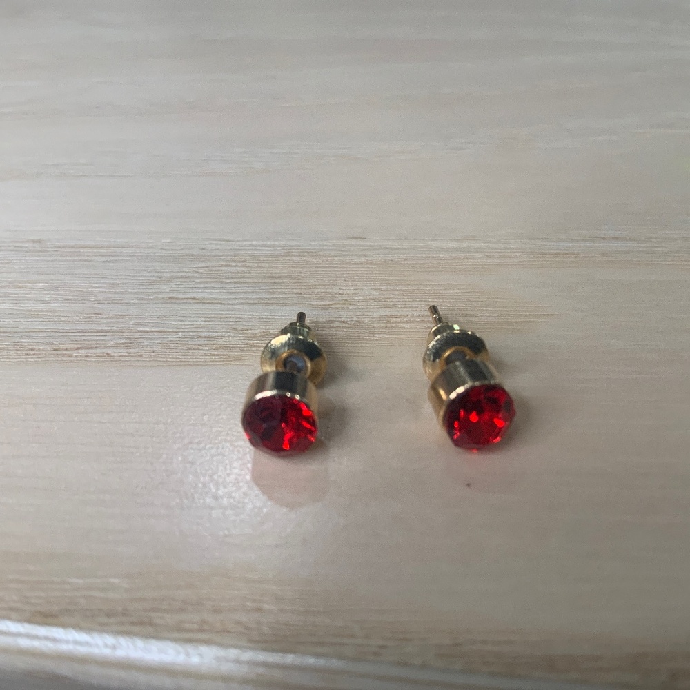 Ruby-colored stud earrings